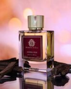 Amber Oud by Ministry of Oud luxury perfume bottle on Arabian-themed background