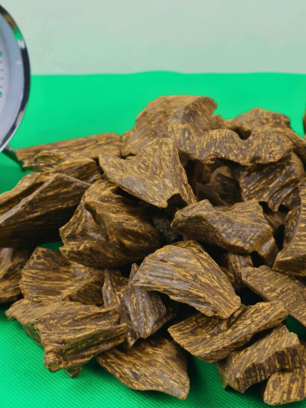 Dark brown resin-saturated Indonesian Kalimantan oud chunk – premium agarwood for burning.
