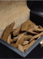 Dark, resin-saturated Royal Indonesian Moruki oud chunk – luxury premium burning agarwood.