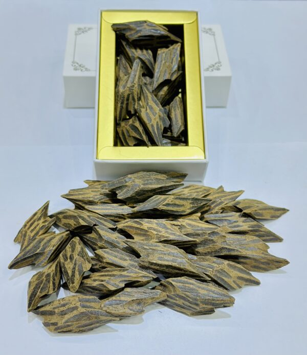 Highly scented Vietnam Tiger Mohassan Oud piece — dark brown, resin-rich agarwood from Vietnam.