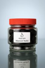 قُرص معمول ملكي – Mamoul Malki Black Capsule | انعكاس ناعم على سطح زجاجي | أفضل معمول وحلويات شرقية